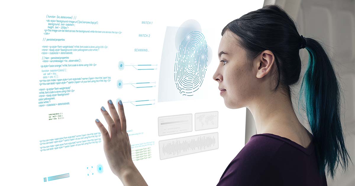 a woman coding on touchscreen